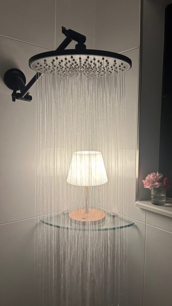 an outdoor waterproof lamp being used in the shower